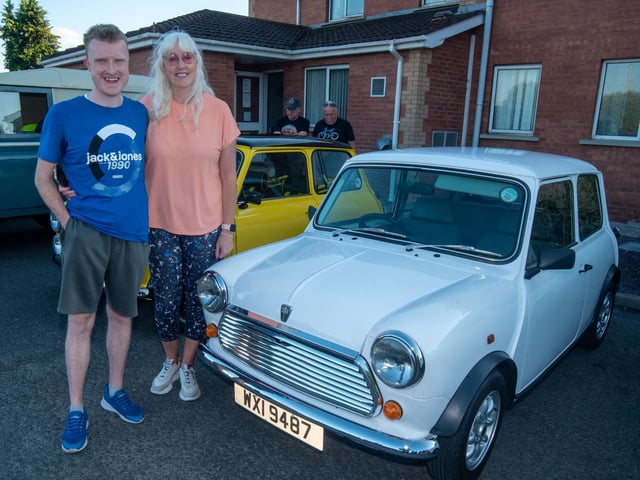 Pictured with a vintage Mini are Jacob and Rhonda Brown.