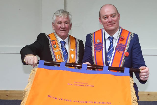 Hon. Bro. Sammy Quinn and Wor. Bro. David Keers W.M. showing off the reverse of the bannerette presented by Hon. Bro. Sammy Quinn