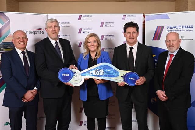 Rail services between Belfast and Dublin are set to benefit from a €165million (£141.9million) investment from the PEACEPLUS Programme. Pictured (left-right) are Ian Campbell, director of service operations, Translink; Intrastructure Minister John O’Dowd; Gina McIntyre, CEO SEUPB; Irish Transport Minister Eamon Ryan, and Billy Gilpin, director of train operations, Iarnród Éireann. Picture: Michael Cooper