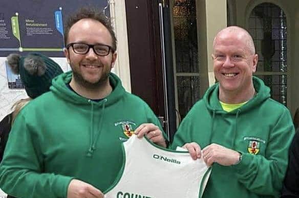 Colin Gilmore (right) outgoing Chairman is pictured at a recent event with Chris Dickey (left) the new Chairman of County Antrim Harriers. (Pic: Contributed).