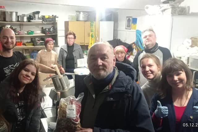David pictured with charity volunteers in Ukraine.