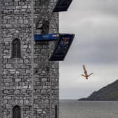 Pierrick Schafer of Switzerland dives from the 27 metre platform during the final competition day of the fourth stop of the 2024 Red Bull Cliff Diving World Series at Ballycastle Harbour, Causeway Coast, Northern Ireland on July 20, 2024.