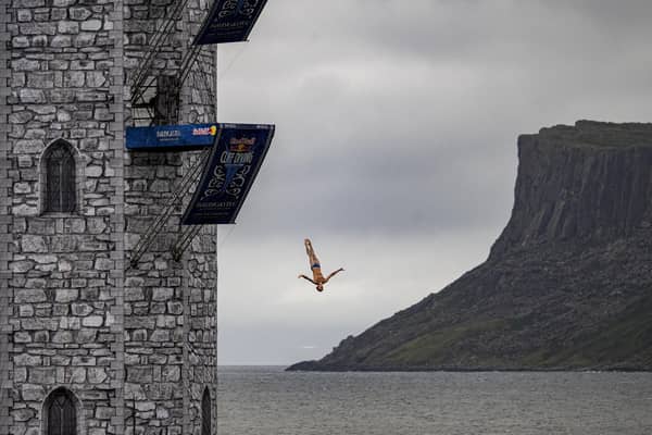Pierrick Schafer of Switzerland dives from the 27 metre platform during the final competition day of the fourth stop of the 2024 Red Bull Cliff Diving World Series at Ballycastle Harbour, Causeway Coast, Northern Ireland on July 20, 2024.