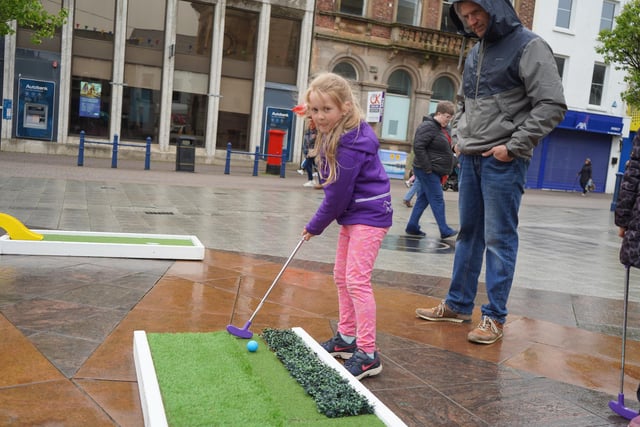 Heavy rain didn't stop this budding Rory McIlroy getting in some putting practice in Coleraine town centre during Coleraine BID's Easter family fun days.