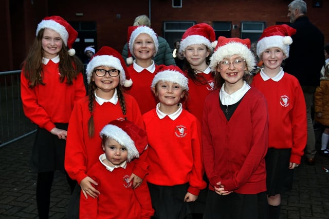 All decked out in their Santa hats are members of the Tullygally Primary School Choir who sang for the crowd at the Christmas lights switch on at the Legahory Centre, Craigavon on Wednesday. PT49-207