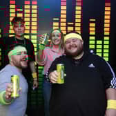 Comedians Ciaran Bartlett and William Thompson with team members.