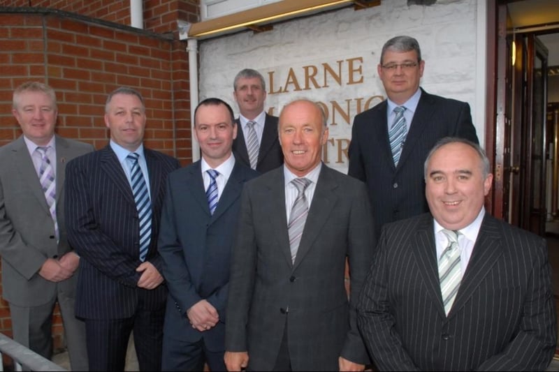Special guest at the Larne branch of the Manchester United Supporters' Club dinner in 2009 was Sammy McIlroy pictured here with members of the committee.