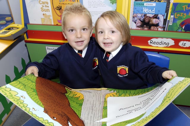 Four-year-old twins Matthew and Emma Hewitt eager to learn during their first days at Orchard County Primary School in 2007.