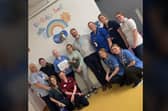 Summer O'Brien from Lurgan, Co Armagh with some of her family and staff at the Children's Cancer Unit in Belfast.