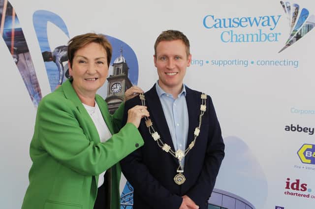 At the Causeway Chamber of Commerce AGM, the out-going President Ann-Marie McGoldrick is pictured placing the chain of office on the new Chamber President James Kilgore. Credit Ciaran Clancy