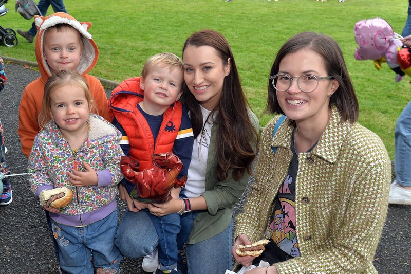 Having a great time at the charity fun day at Laurelvale Cricket Club on Saturday are the McDonald family including, from left, Joe (4), Molly (2), Thomas (3), Robyn and Emma. PT39-210.