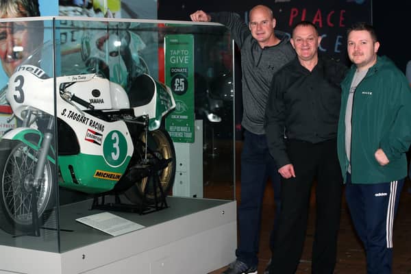 Pictured beside Joey Dunlop's bike which features in the exhibition, are from left:  Ryan Farquhar, Philip McCallen and son of Joey Dunlop, Gary Dunlop. Picture: Declan Roughan / Press Eye