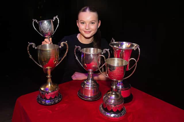 Sweeping the boards...Sarah Reynolds pictured with her haul of trophies which she picked up on the final night of  Portadown Speech Festival. PT10-211.
