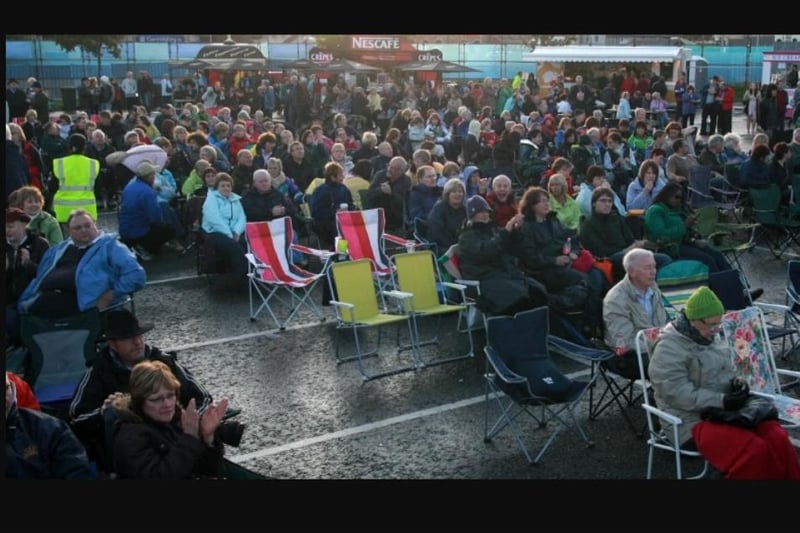 Concert-goers came prepared for the elements at Carrickfergus waterfront in 2009.