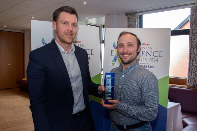 Jonathan Jamison, left, presents the Sustainable Business Award to Ian Whyatt of winners Carrick Community Greengrocers. CT17-201.