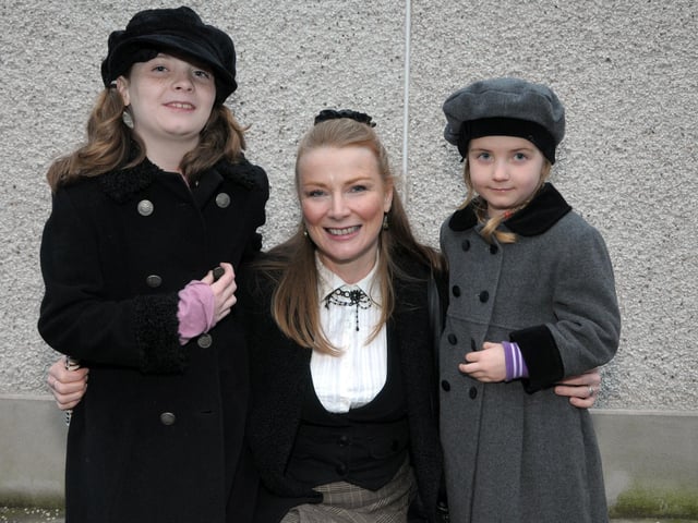 Aimee, Anne and Jodie Irvine all in Victorian dress at Whitehead fair in 2014.