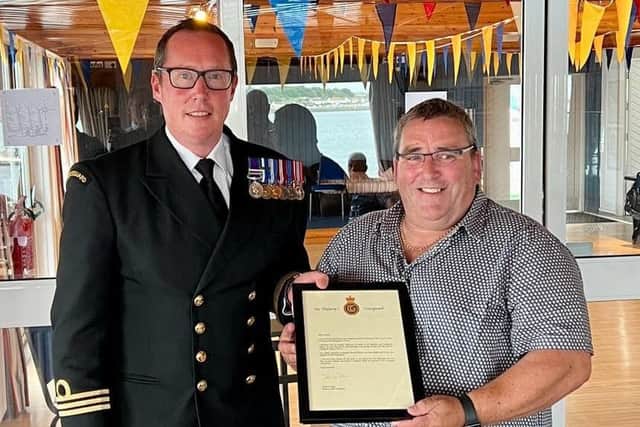 Auxiliary CRO Michael McSparron receives certificates from SO Rob Stevenson to mark his retirement after 31 years service with HM Coastguard.  Photo: Michael McSparron