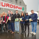 Local suppliers and members of the Smyth’s EUROSPAR Ballymoney team. (L-R) Aideen O'Hagan from Lakeland Dairies, Katie Carson from Mash Direct, Eamon McGarrell from Tom & Ollie, Emma McFadden from Mash Direct, Ashlee Allen from EUROSPAR Ballymoney, Grace McCook from EUROSPAR Ballymoney, Lynsey Evans from Henderson Group, Paula McCook from EUROSPAR Ballymoney, Samuel Smyth, Store Owner, Connor Nicholl from Milgro, Matthew Hollyhurst from Willowbrook Farm, Naomi Anderson from Gilfresh Produce, Connor McCaffrey from Dromona and Matthew Johnston from Gilfresh Produce. Credit Aaron McCracken