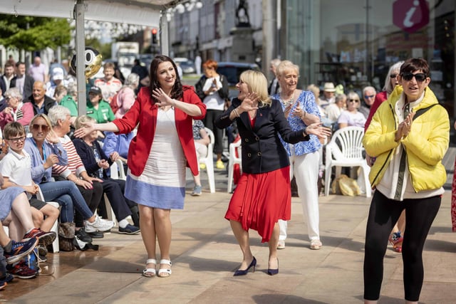 Deputy First Minister Emma Little Pengelly and Alderman Amanda Grehan from LCCC enjoy the celebratory tea dance in Market Square Lisburn.