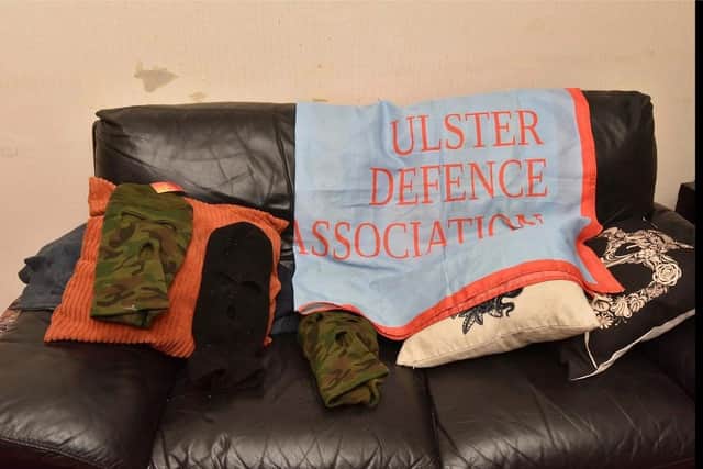Police image of military style clothing, gloves and balaclavas.