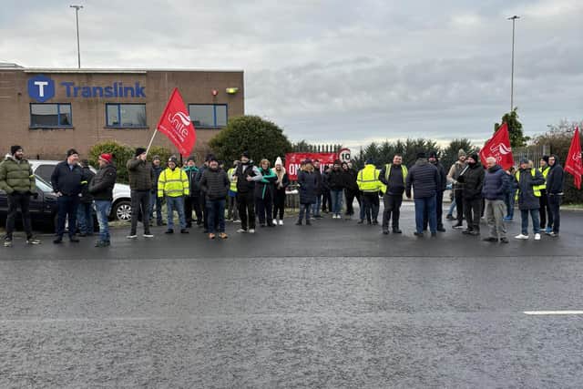 Workers at the Craigavon depot of Translink on the picket line. Workers across NI are taking strike action over pay.