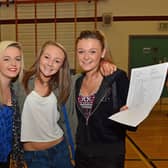 Paige Morris, Donna Creaney and Lisa Armstrong from Ulidia Integrated College with their GCSE results in 2013. INCT 35-011-PSB  Photo: Phillip Byrne