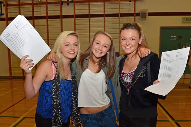 Paige Morris, Donna Creaney and Lisa Armstrong from Ulidia Integrated College with their GCSE results in 2013. INCT 35-011-PSB  Photo: Phillip Byrne