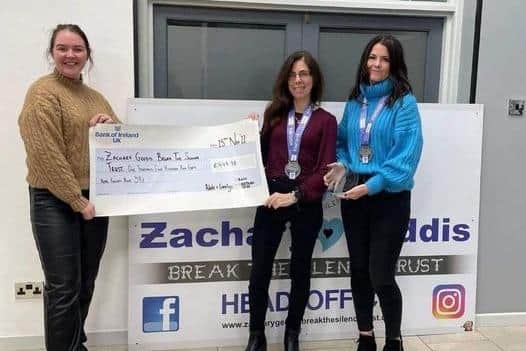 Adele Tomb and Carolyn Crawford presenting Yasmin Geddis with the fundraising cheque