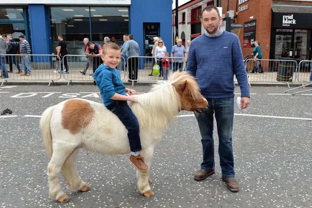 Ryan and 6-year-old Colton Hanson pictured with their Shetland pony at the 2018 Ballyclare May Fair. INNT 21-003-PSB