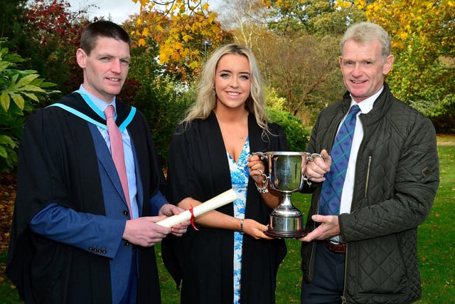 Laura Kennedy, Larne, who received the National Beef Association Cup for performance in beef production at the Greenmount Campus graduation event, is congratulated by Stephen Heenan and course lecturer John Hamilton.