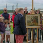 Taking a closer look at one of the items brought to the Antiques Roadshow event in Derry / Londonderry. Picture: submitted by Derry City and Strabane District Council