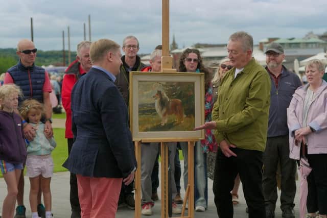 Taking a closer look at one of the items brought to the Antiques Roadshow event in Derry / Londonderry. Picture: submitted by Derry City and Strabane District Council