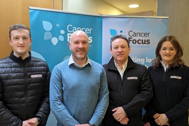 Hugh, Maria and their son Michael Doyle with Cancer Focus Northern Ireland chief executive Richard Spratt at Cancer Focus Northern Ireland headquarters in Belfast. Credit: Submitted