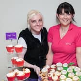 Joanne Trimble with Christian and Laura Glass from Simply Devine with her special Hospice cupcakes at the 2012 fashion show in the Knockagh Lodge.