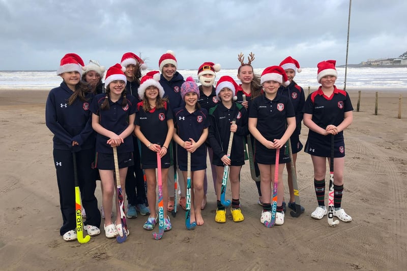 Pictured during their sea dip debut on Portstewart Strand are the brave Year 8 pupils from Coleraine Grammar School; Amber Miller, Anna McGreevy, Elise Archibald, Erin Semple, Eva Grace Patterson, Isabella McCarron, Jasmine Moore, Jessica Cartmill, Josie Dixon, Lucy Blackstock, Poppy Ewing, Sarah McCaughey and Tilly Lyttle