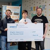 Pictured (L-R) is Power NI representative Barry Rogan, student Oisin Doherty, and REACH Across project organiser Ryan McGuigan.