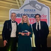 Danielle Martin from SPAR Mallusk, Newtownabbey is presented with the Forecourt Trader Award for Best Food-to-Go Outlet. Also pictured are Tony Owen (left) from sponsor Rollover, and awards host, Stephen Mangan. (Pic: Contributed).
