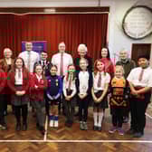 Education Minister Paul Givan pictured with Principal, Simon Patterson, Lady Mary Peters, Dr Melanie McKee, Mayor of Lisburn & Castlereagh City Council, Kurtis Dickson, pupils and members of the school community during his visit to Fort Hill Integrated Primary School. Pic credit: Kelvin Boyes