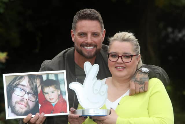 Singer and actor Keith Duffy presents Julia McKeever, founder of The Autism Hive, with her National Lottery Award. Julia set up the charity after losing her autistic son Luke O'Hara to suicide. and was named winner in the Charity/Community category of The National Lottery Awards, which celebrate inspirational individual who do extraordinary things with the help of National Lottery funding. Picture Bill Smyth (free to use)