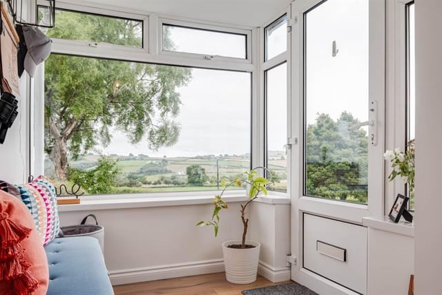 Entrance with picture window giving far reaching views over open countryside to Larne Lough.
