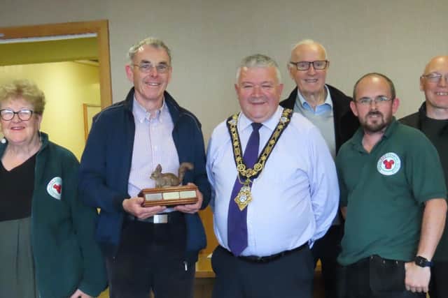 Pictured with the Mayor of Causeway Coast and Glens Borough Council, Councillor Ivor Wallace, are Glens Red Squirrel Group members Tom Mc Naughton, Liz Weir, Gerard McCaughan, Joe McKavanagh, Daniel McAfee (Group Chair) and Gabriel McCauley.