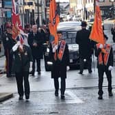 Standard bearers leading the funeral procession along High Street.  Photo courtesy of Tommy Mahood