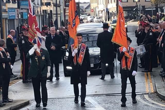 Standard bearers leading the funeral procession along High Street.  Photo courtesy of Tommy Mahood