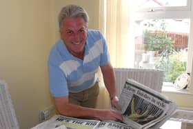 Mickey McDonald looks through the reports of his nephew Rory McIlroy at the Open Championship. LM30-132gc