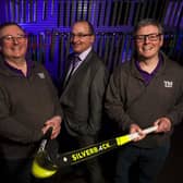 Ulster Bank’s Derick Wilson (centre) pictured with Alan McMurray (left) and Steven McMurray (right) of Total Hockey.