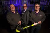 Ulster Bank’s Derick Wilson (centre) pictured with Alan McMurray (left) and Steven McMurray (right) of Total Hockey.
