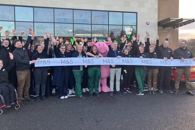 Patricia Woods cuts the ribbon to mark the official opening of the new M&S store in Coleraine.