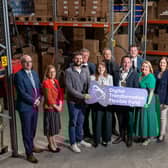 From left: Martin McKendry (Head of Food, Farming & Rural Affairs Group DAERA), Tracy McAvoy (Client Executive, Regional Business Team (Invest NI), Stephen Henderson (Owner SJ Henderson Fulfilment), Stephen Wightman (Director, City & Growth Deals (Invest NI)), Dr Caoimhe Archibald (DfE Minister), Michael Forster (FFNI Operations Lead), Councillor Pete Byrne (NMDDC Chairperson), Steven Norris (ANBC Chair of the DTFF Operations Group), Sheila Walker (Head of Rural Affairs Investment Branch), Amanda Smyth (NMDCC Assistant Director: Economy, Growth and Tourism) and Paula Jones (Project Officer (Digital Innovation and Regeneration))