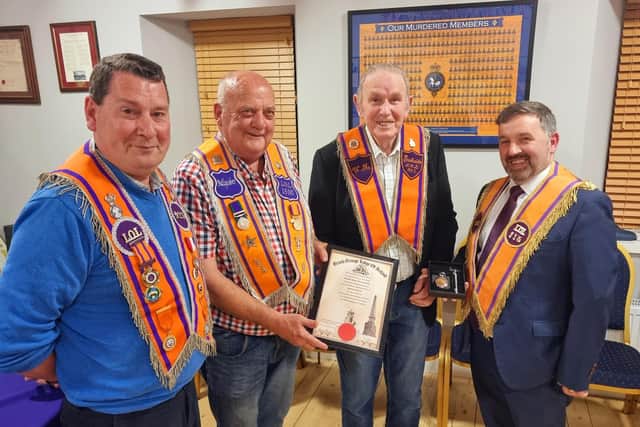 Members of Bushside LOL 923 along with some visiting Orangemen, including Ulster Unionist MLA for North Antrim Robin Swann, marked the occasion with multiple tokens of appreciation being presented to Mr Johnston to mark 40 years as Worshipful Master of Bushside Orange Lodge. Credit Aaron Stewart