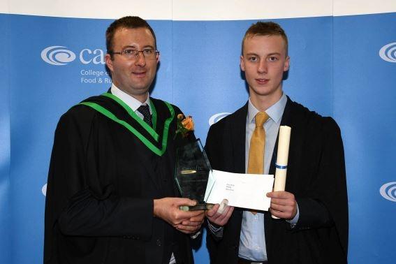 Alex Millar (Antrim) received the Moore Memorial Prize presented to the best overall student on the Level 2 Advanced Technical Certificate in Agriculture from his Programme Manager, Bernard McCloskey at the Greenmount Campus graduation ceremony.